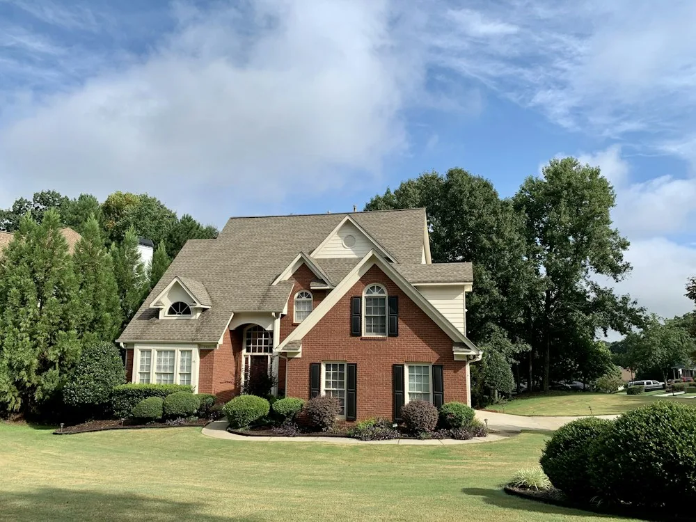 Sample home: brick colonial on a landscaped lot